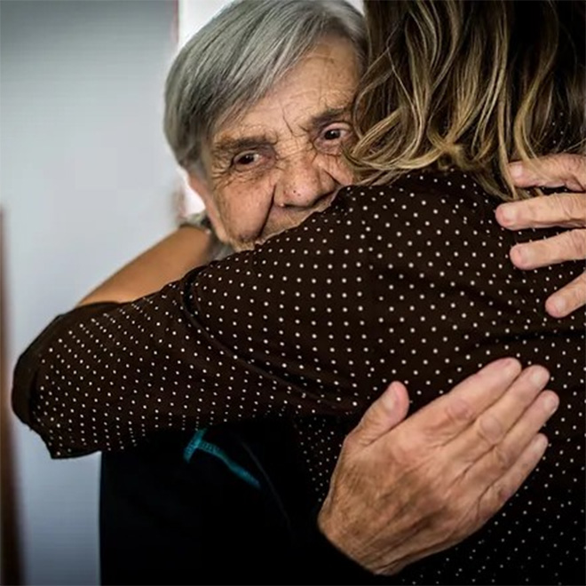 senior citizen hugging