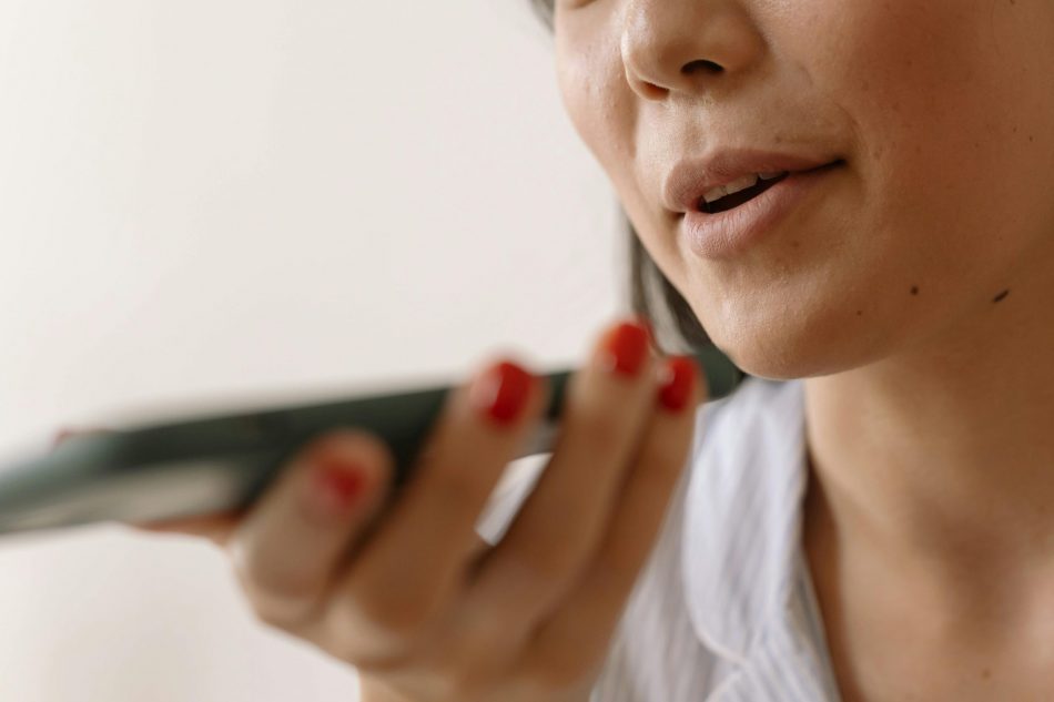 woman accessing an audio operating system through her phone